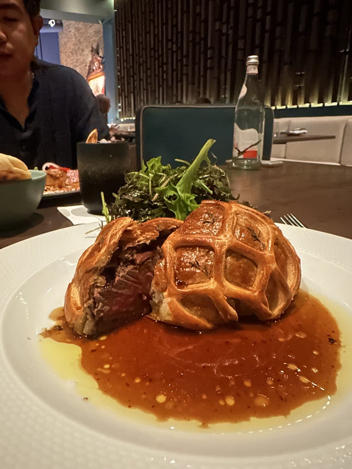 Beef Wellington in latticed pastry with jus and dressed greens at Azahar, Bella Vista, Panama City