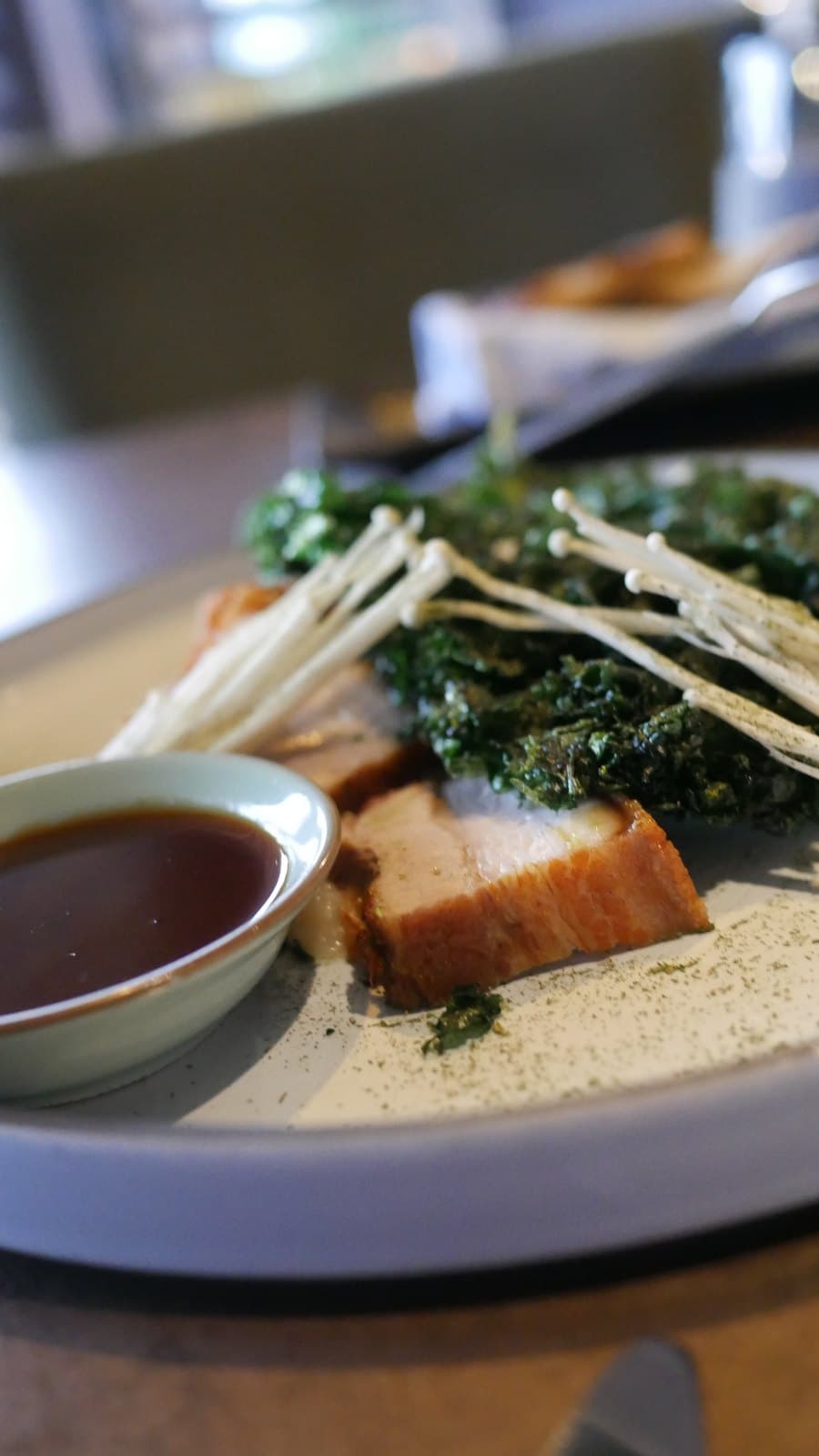 Pork belly with crisped kale, enoki mushrooms and a dark sauce at Azahar, Bella Vista, Panama City