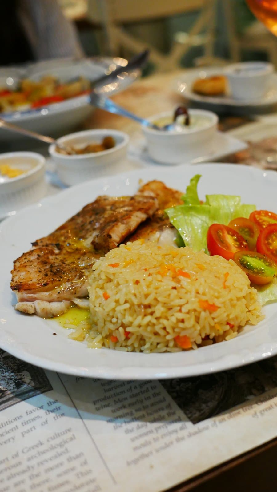A seabass fillet at Meze served with rice and a small salad