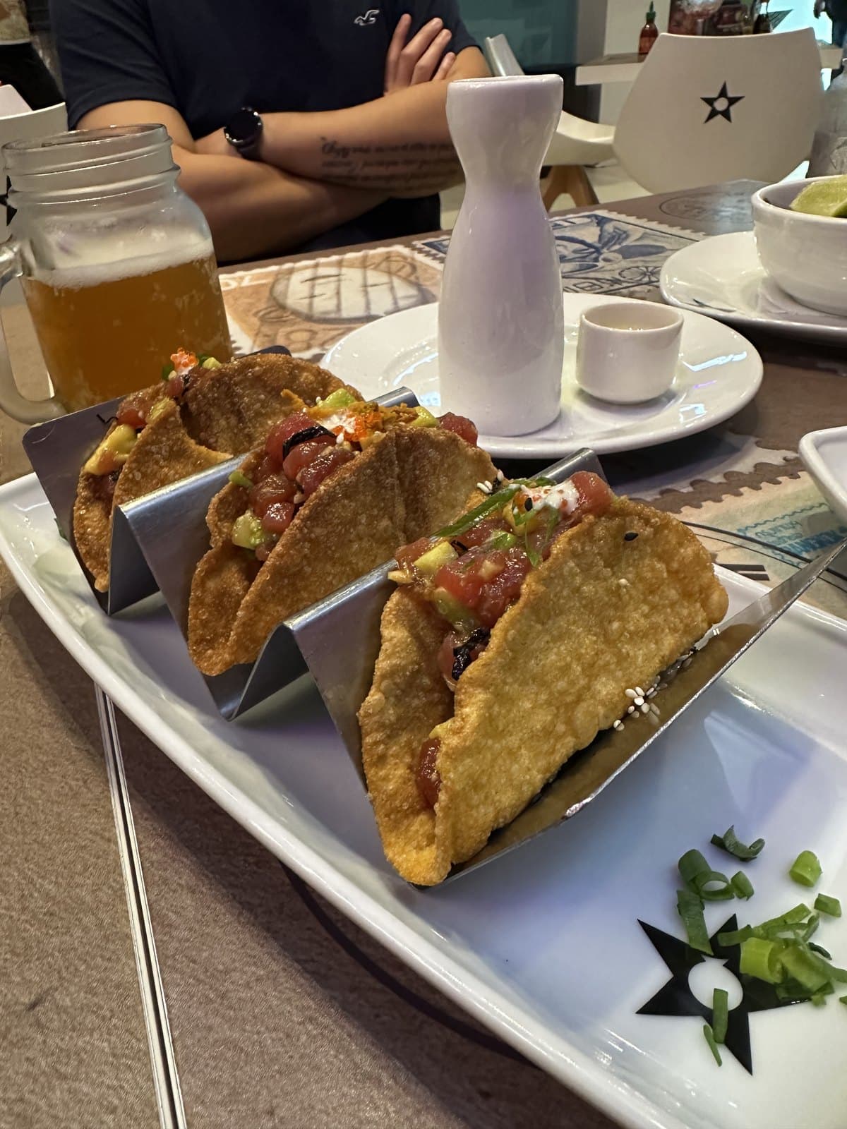 Taquitos Tuk Tuk at Nacion Sushi: crisp shells filled and stood upright on a white plate