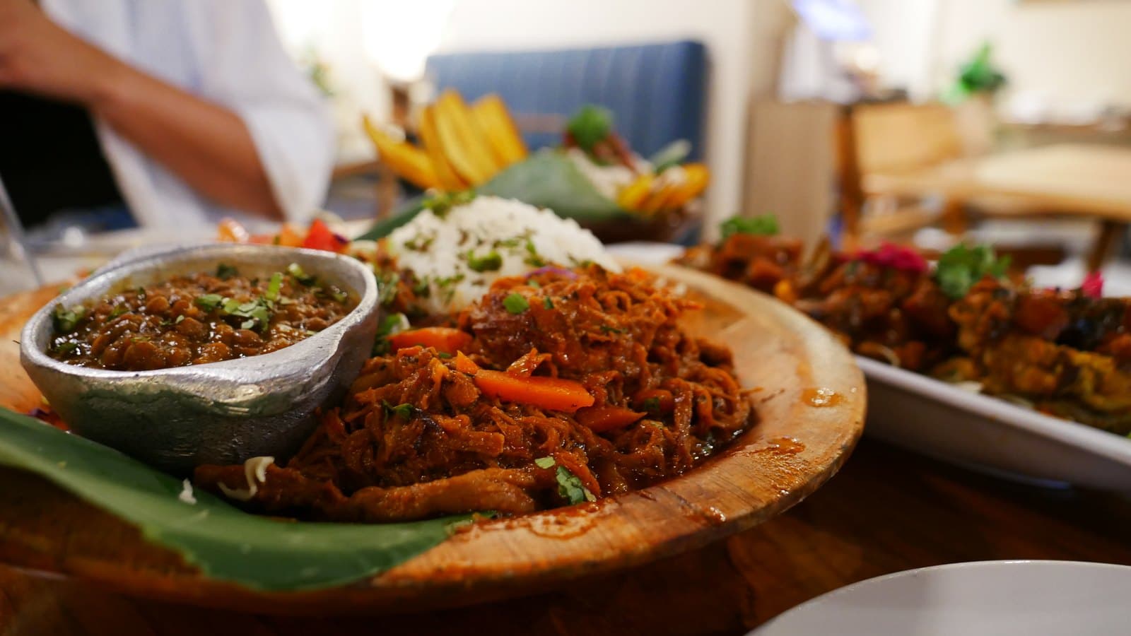 Ropa vieja at El Nacional: shredded beef with rice and tomato salad on a banana leaf