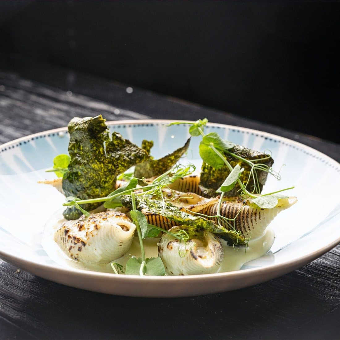Conchiglioni de Shortrib at Azahar: filled pasta shells with crisp seaweed and herbs