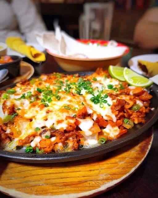 Sizzling alambre with melted cheese at Agave Azul, Panama City