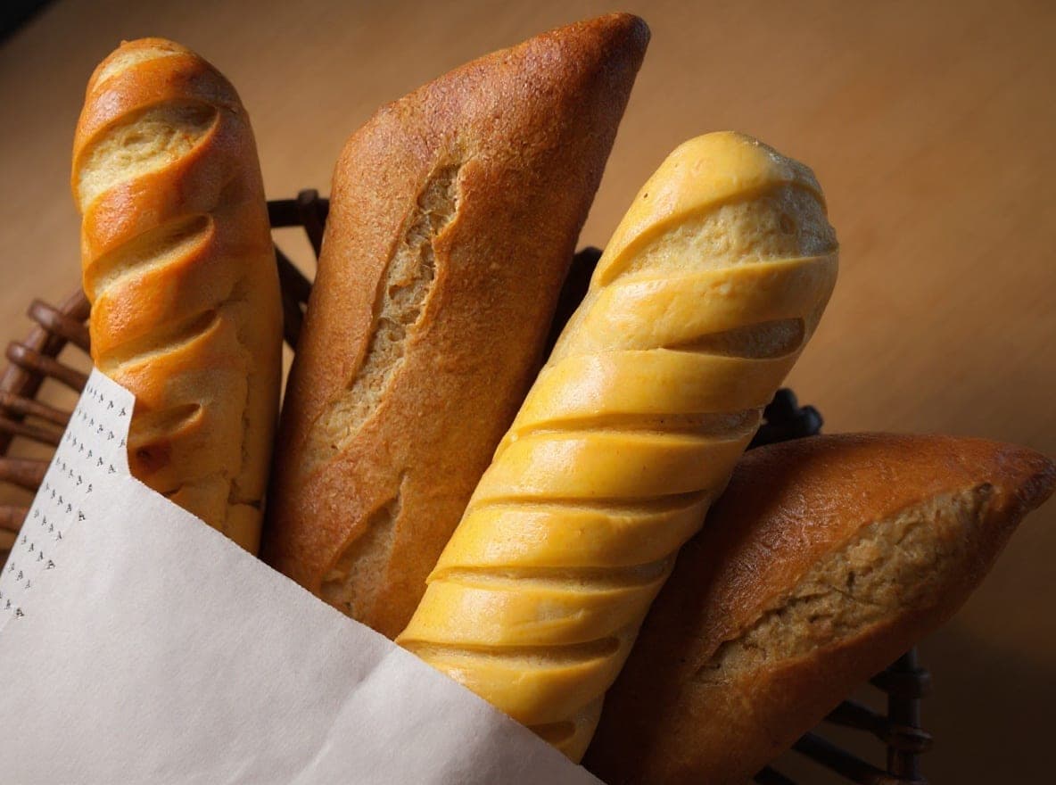 Basket of freshly baked breads and baguettes from the Greek bakery-caf at Athanasiou, Casco Viejo, Panama City