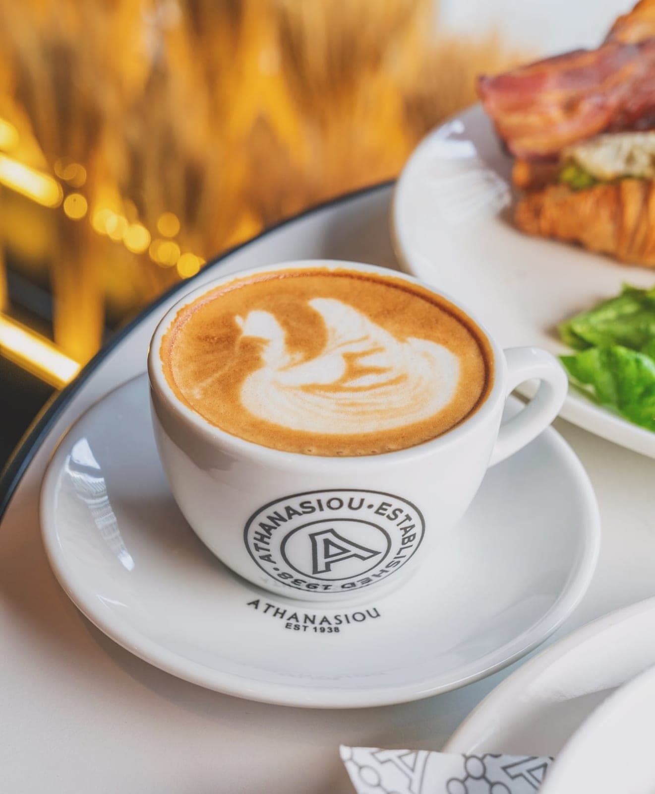 Cappuccino and a croissant sandwich at Athanasiou, Panama City