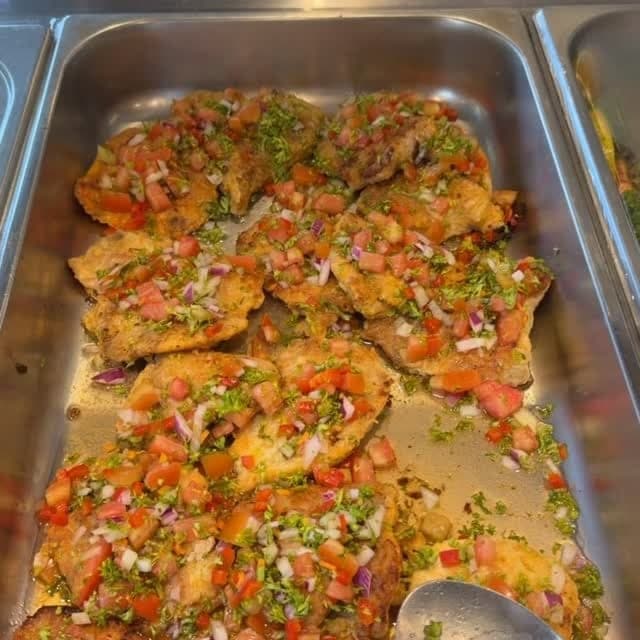 Fish with criolla salsa at Cafe Edwards, El Cangrejo, Panama City
