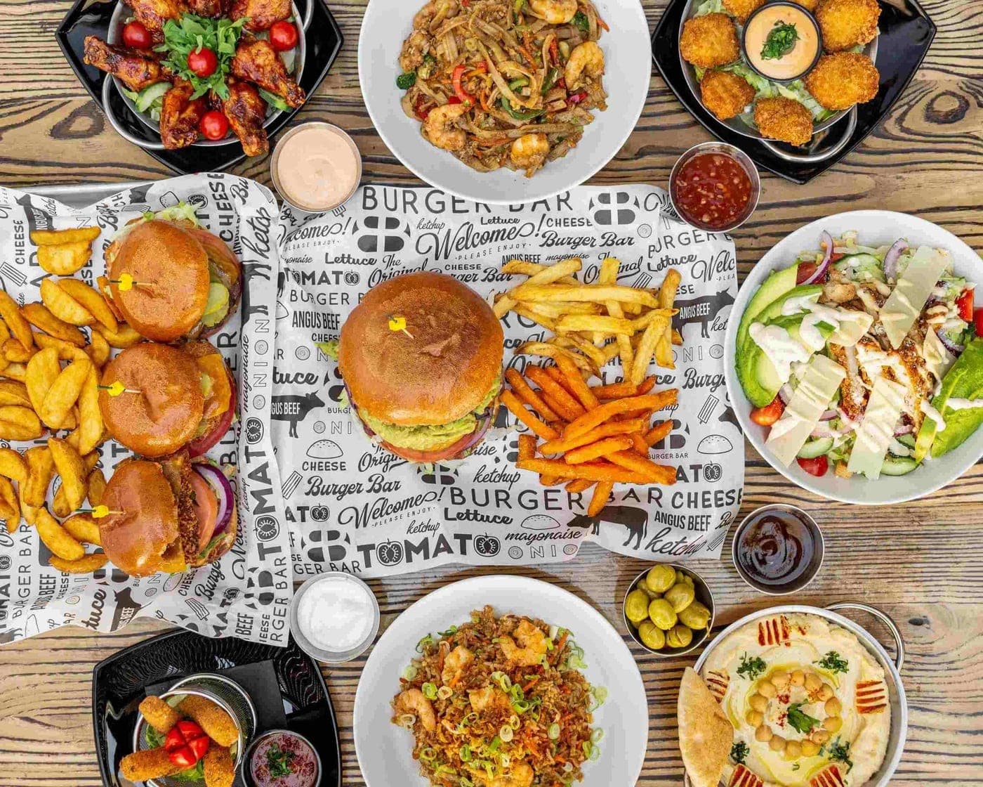 spread of burgers, fries and salads at El Burger Bar, Panama City