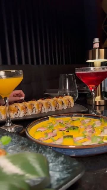 Sushi rolls and mango tiradito served with cocktails at Furia, Bella Vista, Panama City