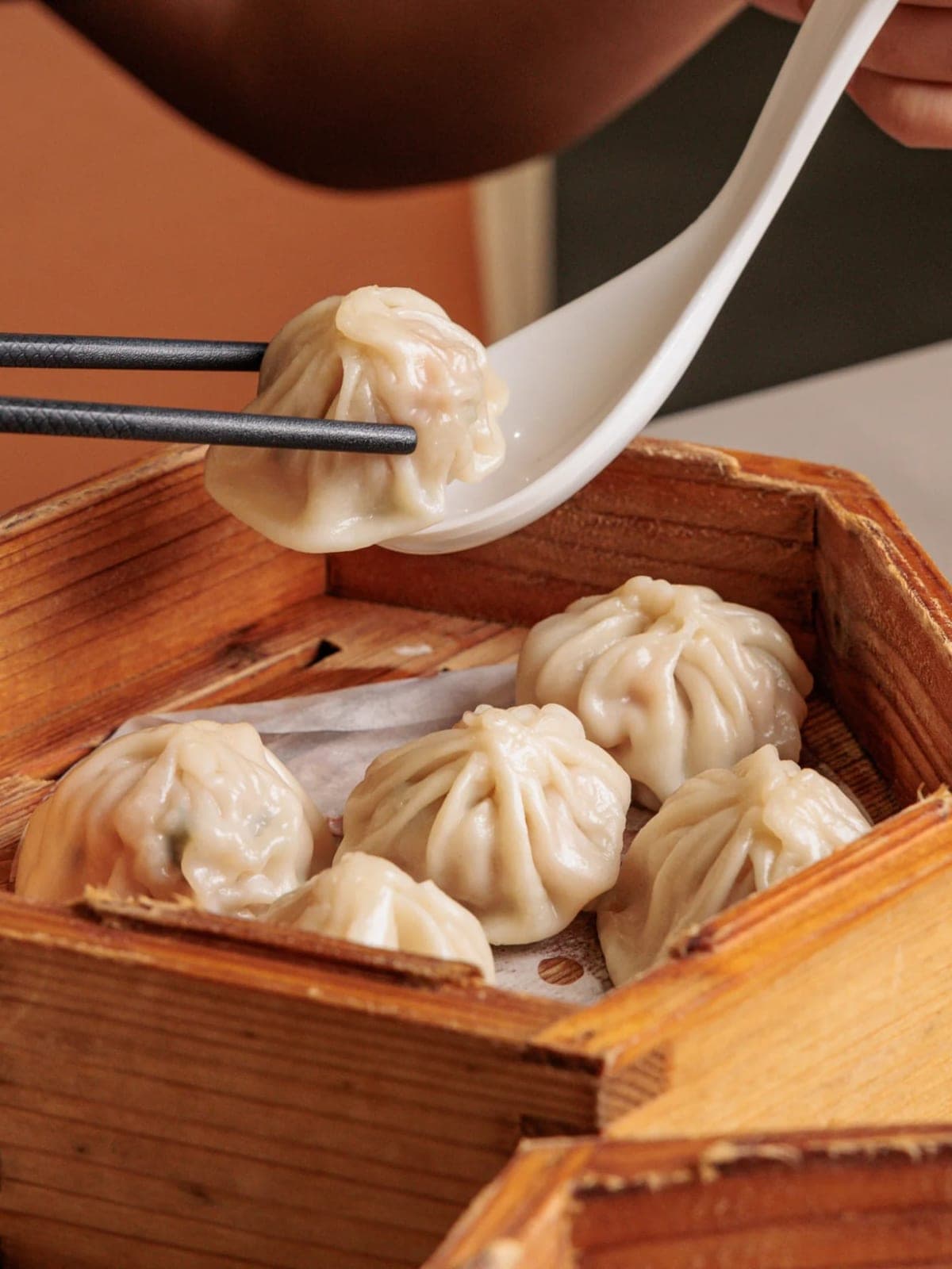 Xiao long bao soup dumplings in a bamboo steamer at Hong Kong Bakery, Costa del Este, Panama City