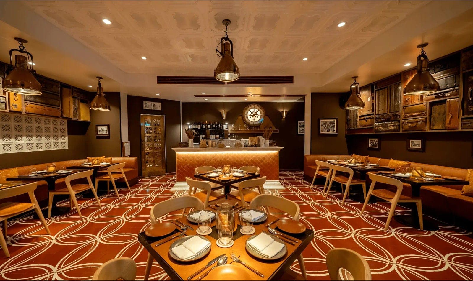Trattoria dining room with set tables, banquettes and patterned tile floor at Luigi's Cucina Povera, Casco Viejo, Panama City