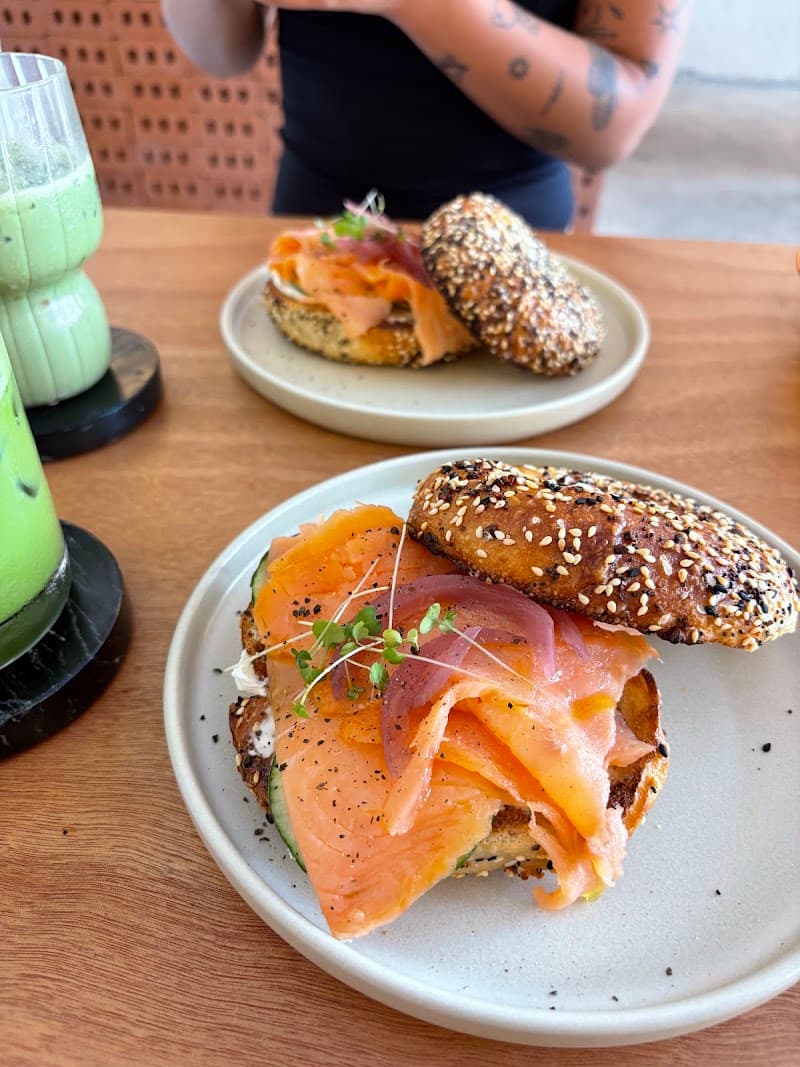 An everything-bagel piled with cured salmon, pickled onion and microgreens at Luna Café, Bella Vista, Panama City