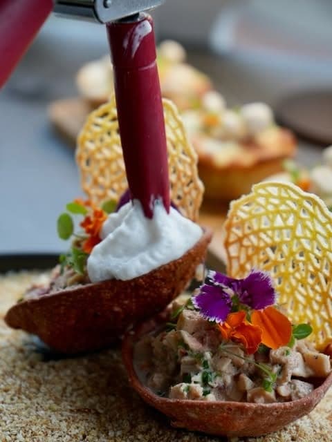 Ceviche tartlets in crisp cassava shells topped with edible flowers at Marula Cocina Boutique, Casco Viejo, Panama City