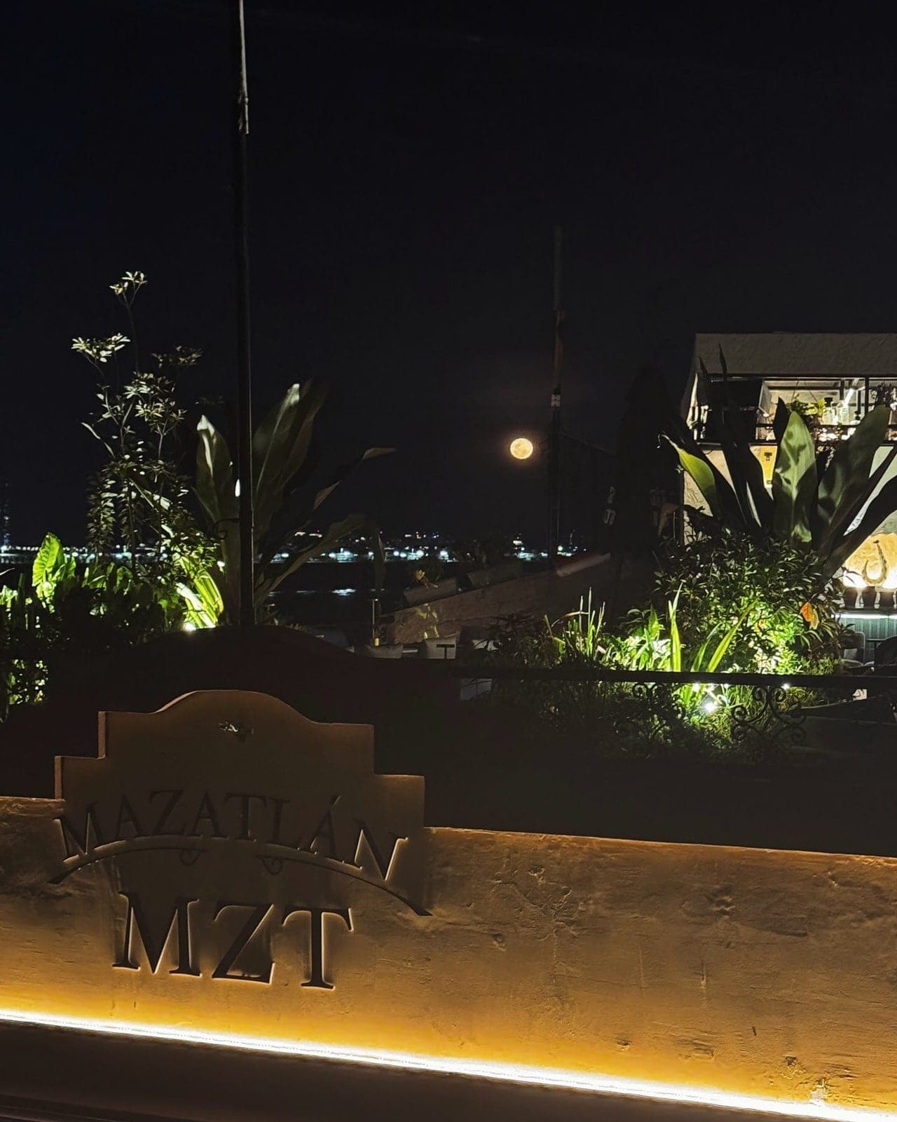 Rooftop deck at night with venue signage and the Panama City bay lights at Mazatlan Rooftop, Casco Viejo