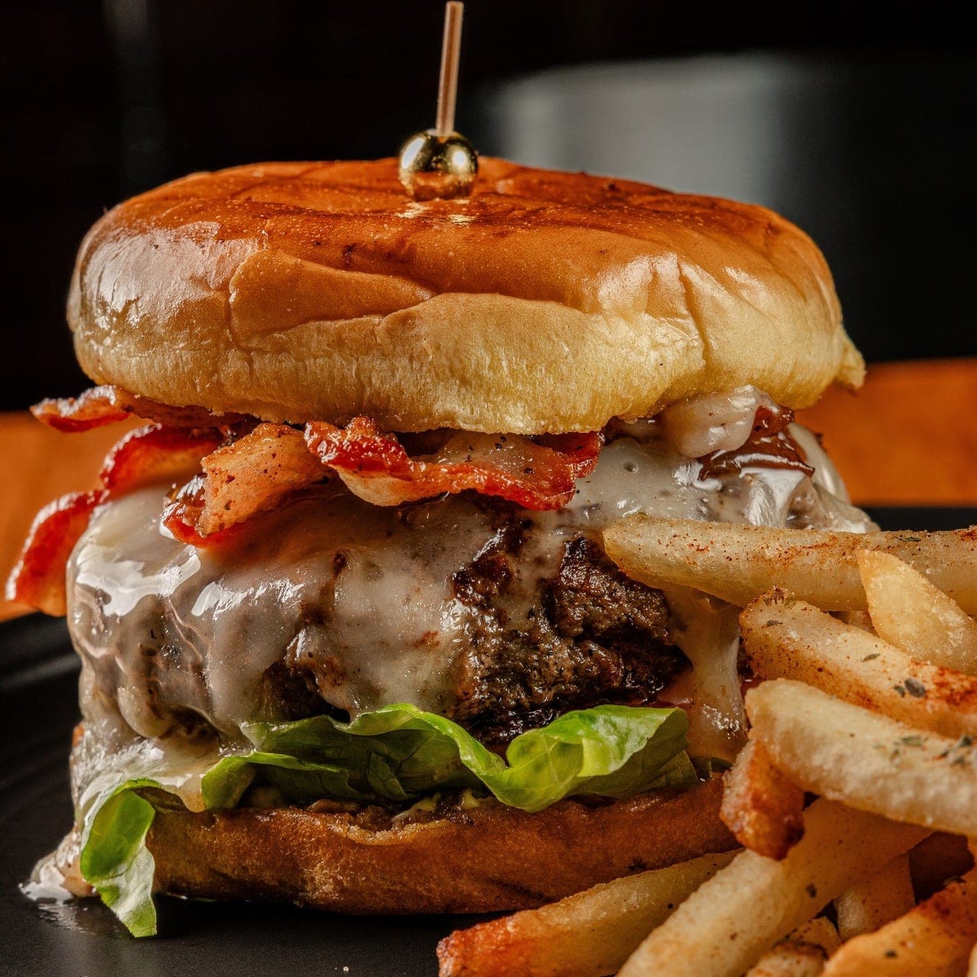 Bacon cheeseburger with fries at Ostinato Pub, San Francisco, Panama City