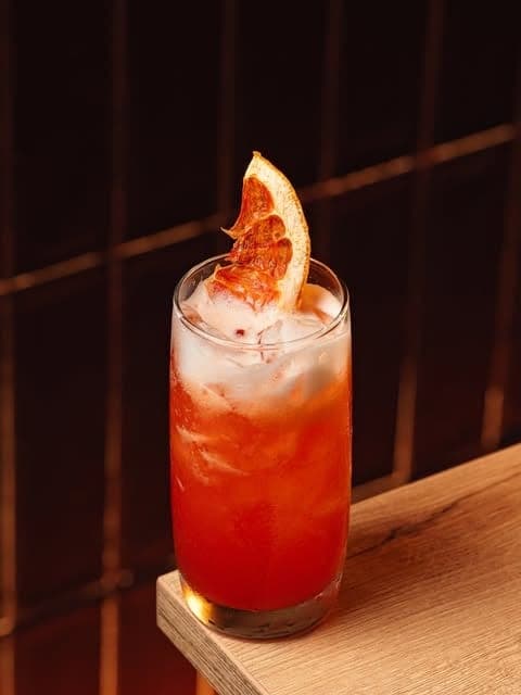 Rum cocktail garnished with dehydrated grapefruit at Pedro Mandinga Rum Bar & Cafe, El Cangrejo, Panama City