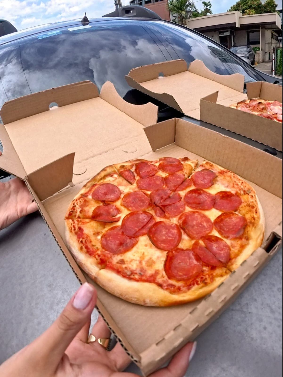 Pepperoni pizza in an open box at La Casa del Queso pizzeria, San Francisco, Panama City