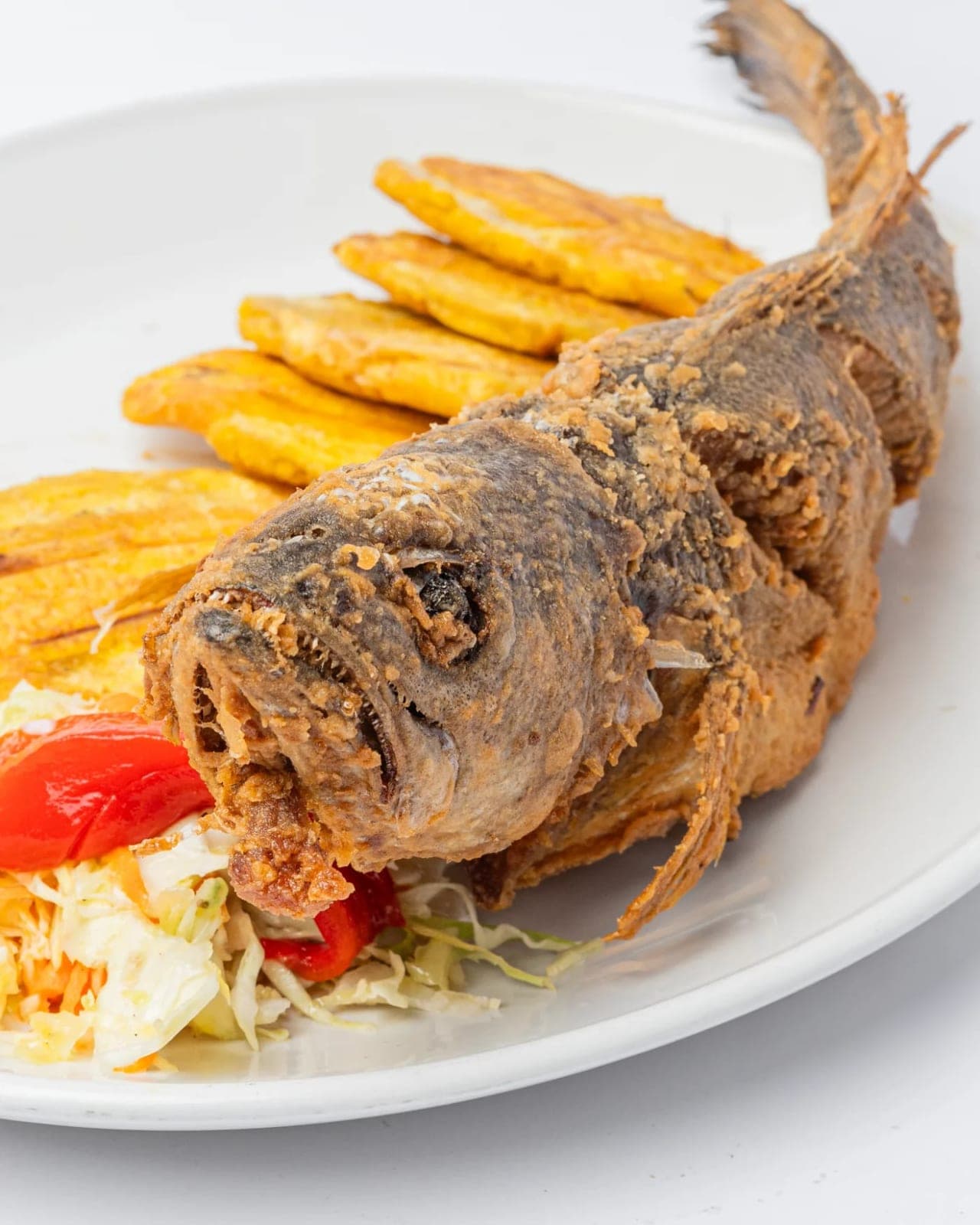 Whole fried fish with patacones at Restaurante Del Prado, Vía Argentina, El Cangrejo, Panama City