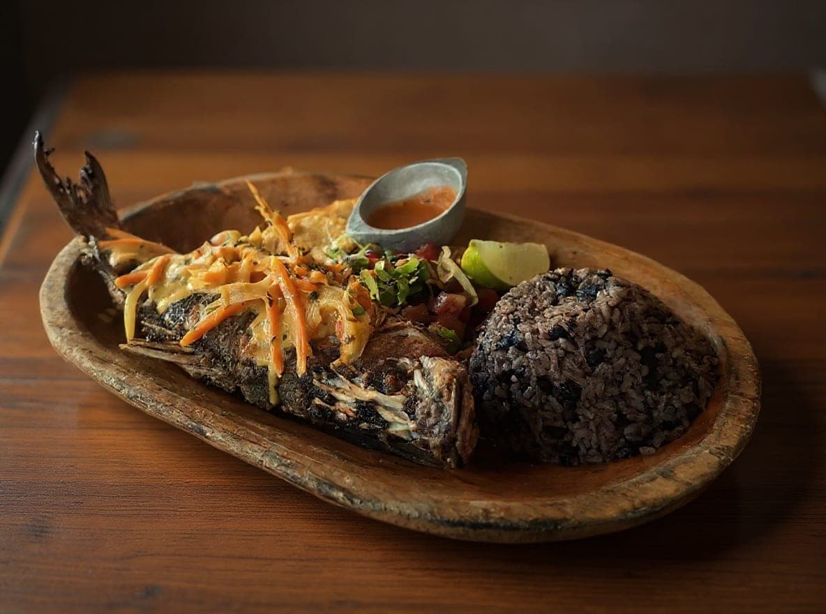 Whole fried red snapper (pargo frito) served with rice, a signature Pa at Restaurante El Nacional Sabores de Panamá, Casco Viejo, Panama City