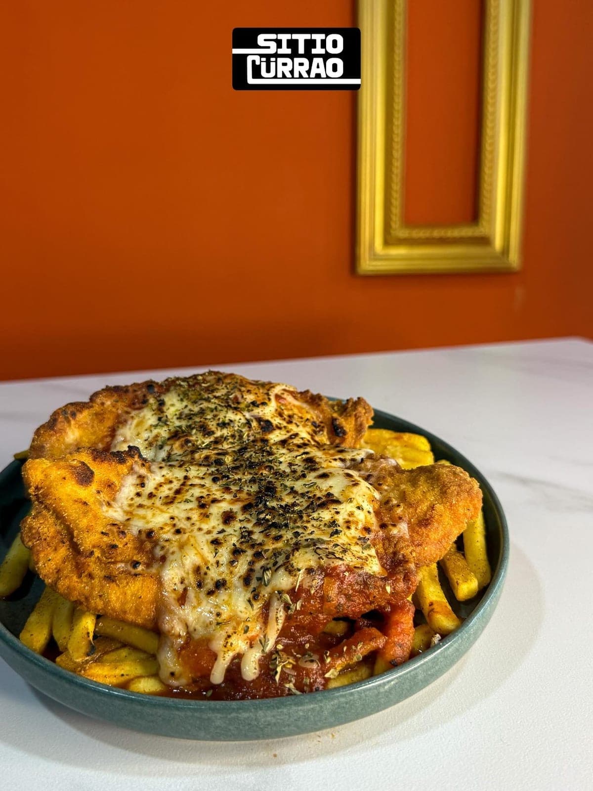 Chicken parmigiana over fries at Sitio Cürrao, Bella Vista, Panama City