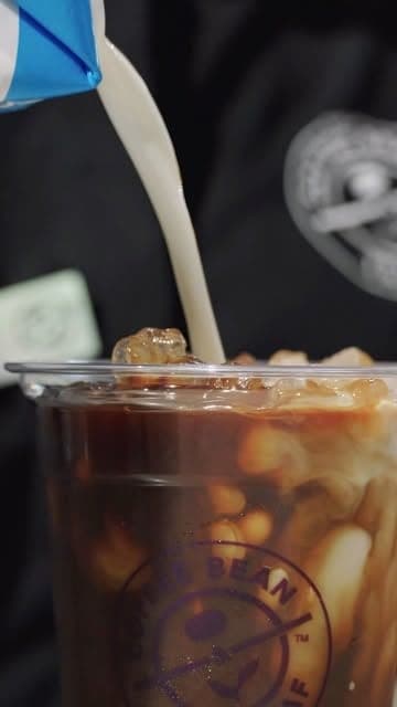 Milk poured into an iced coffee at The Coffee Bean & Tea Leaf, Bella Vista, Panama City